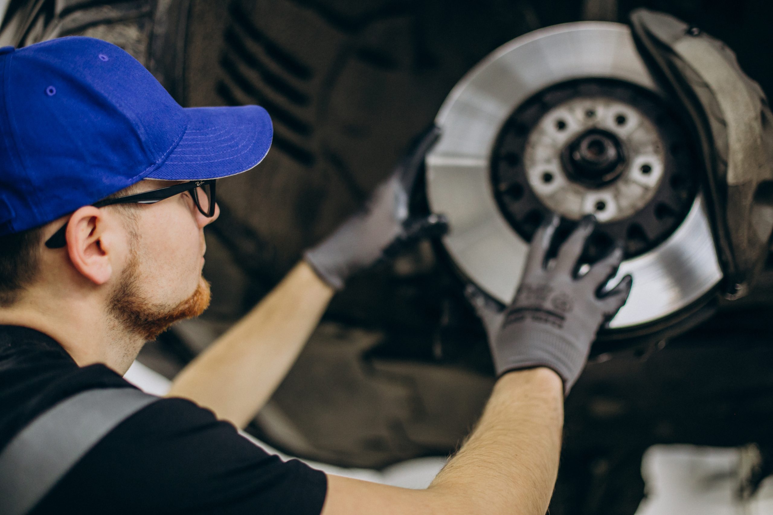 mechanic changing brake discs car service